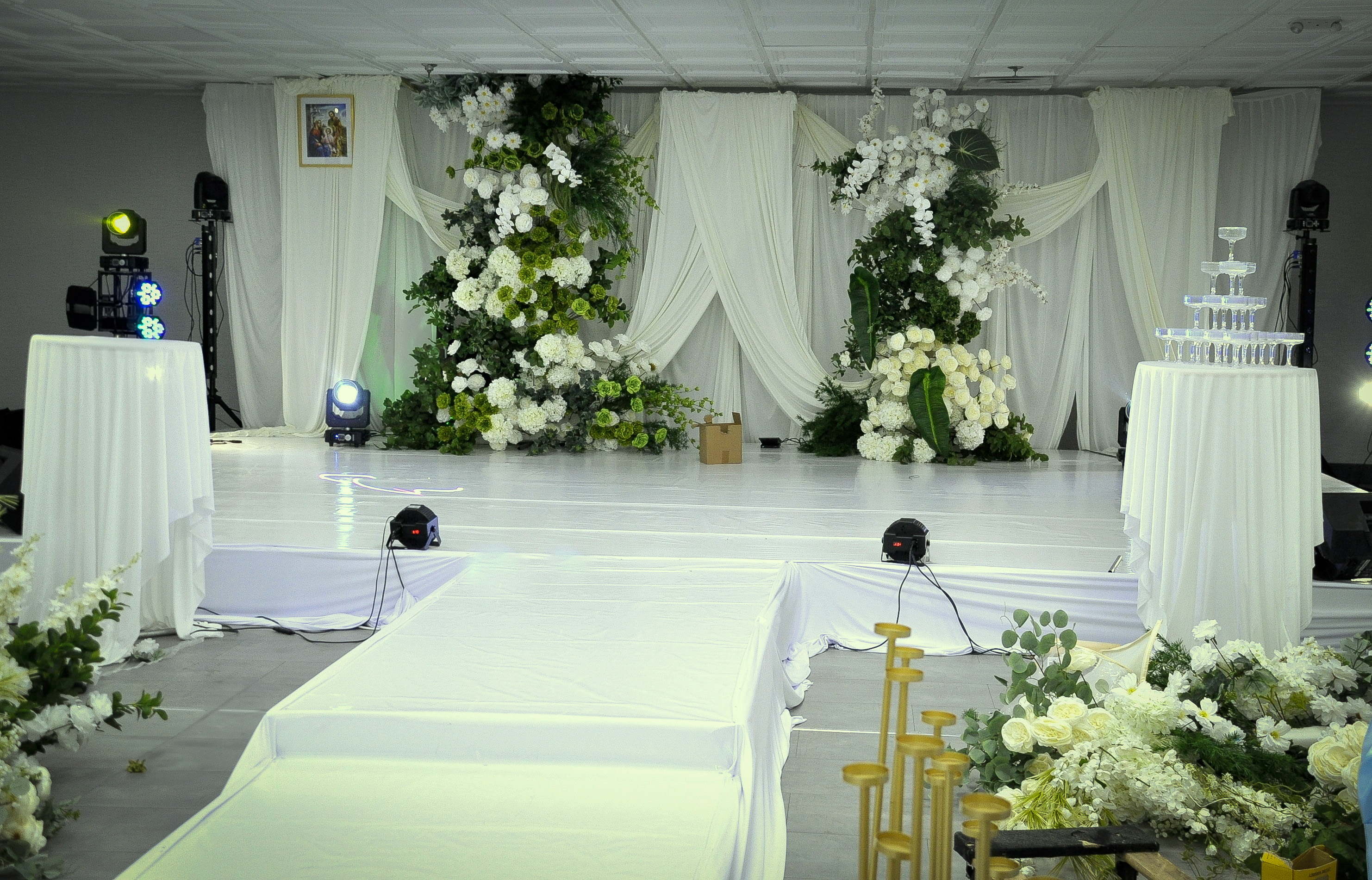 White runway stage set for a wedding entrance